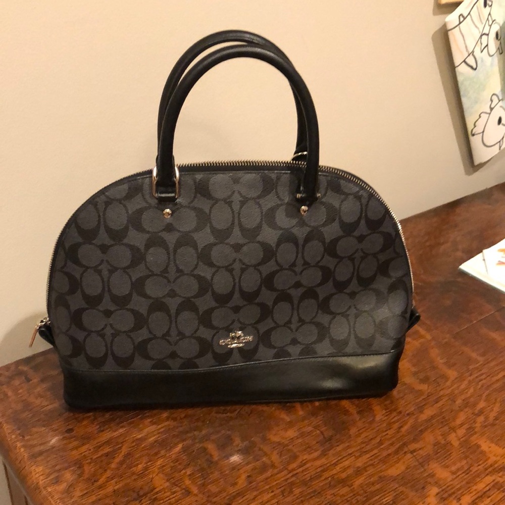 Black on black Coach satchel, symbol pattern .